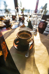 Coffee mug on the table to the cafe