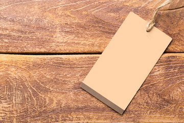 Blank tag, label blank mockup template on a wooden background