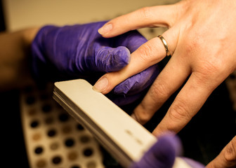 Women do manicures at home. Self-isolation manicure. Nail salon