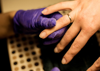 Women do manicures at home. Self-isolation manicure. Nail salon.