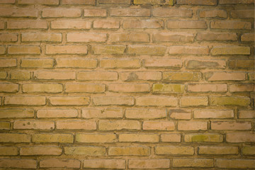 A section of a send brown brick wall background
