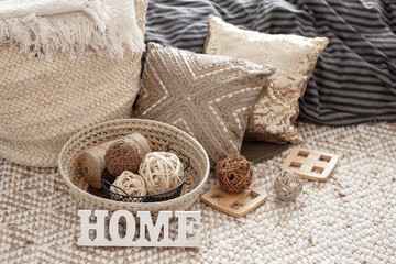 Items of a cozy home interior with pillows.