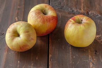 home grown sweet juicy apples on a wooden table