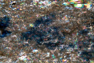 Microscope photo of a petrographic thin section of a lapis lazuli gem stone