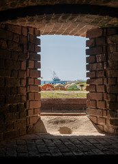 Tents and Boats Framed in Fort Window