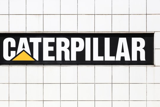 Grenoble, France - June 16, 2019: Caterpillar logo on a wall. Caterpillar is an American corporation which designs, develops, engineers, manufactures, markets and sells machinery, engines