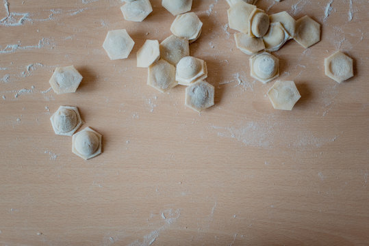 Dumplings on a cutting board in the kitchen close-up.