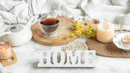Spring still life with a Cup of tea and flowers .