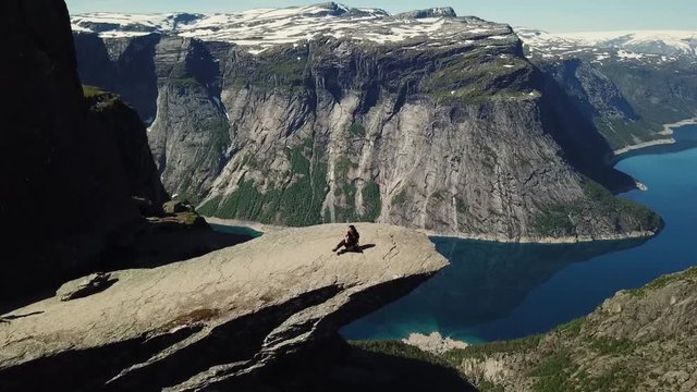 Sitting for the picture in trolltunga - Norway