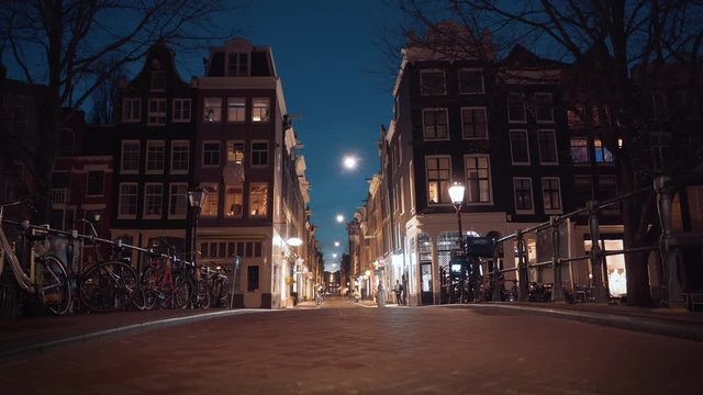 Empty Amsterdam downtown streets in evening, closed restaurants and stores in historical center due to Coronavirus Covid-19 and quarantine in city