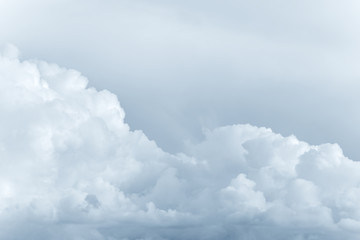 White big fluffy clouds. Natural scenic abstract background. Weather changes backdrop. Sky filled with voluminous clouds.
