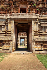 Fototapeta na wymiar Gates in gopuram (gopura - tower, usually ornate, at the entrance of any South India Hindu temple) in Achyutaraya Temple. Ruins in Hampi, Karnataka, India