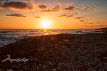 Beauty calm view of the ocean at sunset from coral rocks. Caribbean Cuba