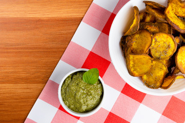 Delicious fried pieces of sweet potato in bowl. Nutritious food concept. Top view.