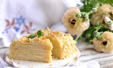 Classic Napoleon cake. Traditional millefeuille dessert with puff pastry and custard, russian cuisine treat, copy space