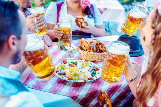 People enjoying food and drink in Bavarian beer garden