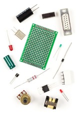 Different electronic parts or components on white with resistors, capacitors, diode and ic chips,...