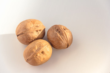Three Walnuts isolated on a white background.