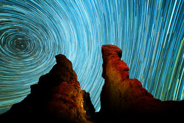 Star trails over rocky landscape in Garden of Eden, Arches National Park, Utah