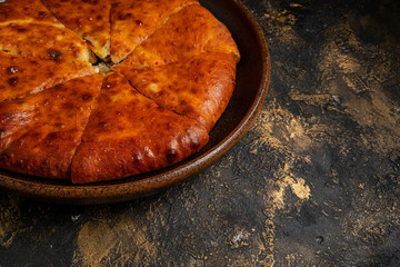 khachapuri with cheese on black background