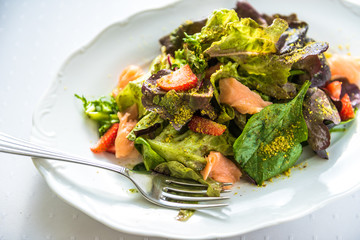 Cooked salmon salad with Norwegian salmon, strawberries