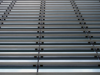 Obraz premium a vertical perspective view of the facade of a modern glass commercial building with steel frames