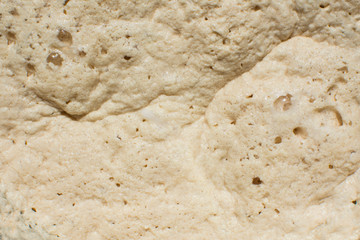 Fermenting yeast dough close up. Healthy homemade raw baking. Abstract art background or wallpaper.
