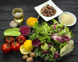 Set of products for healthy nutritio .Cooking of vegetables and herbs for cooking lunch. Sesame seeds, lemon and corn for salad.
