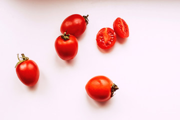 Tomatoes on a pink background