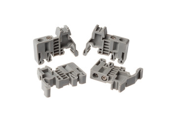 Set of grey stopper block for electrical pass through terminals for DIN rail, isolated on white background