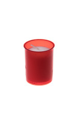 White candle in red plastic holder, isolated on white background