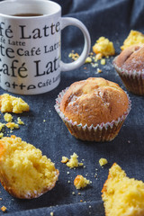 Muffins with coffee on dark background