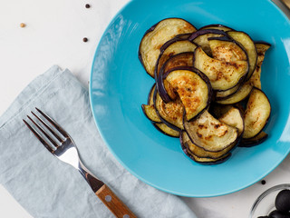Fried eggplant in the blue plate.
