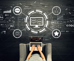 Social media theme with person using a laptop in a chair