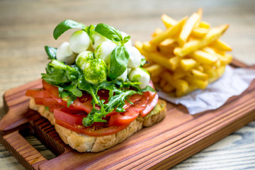 Mozzarella cheese sandwich toast and green lettuce