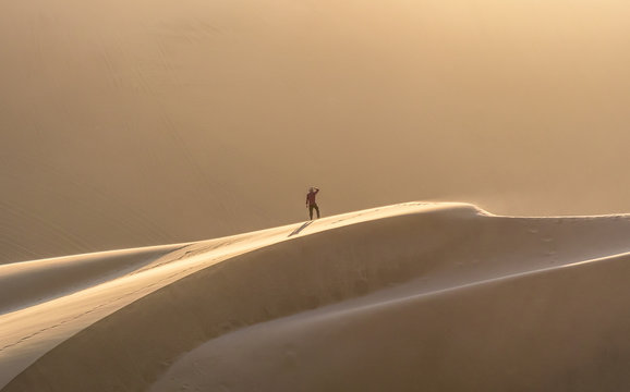 Man Watching Sunset On Dune 7