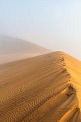 Fototapeta na wymiar Dune 78 sunrise with fog