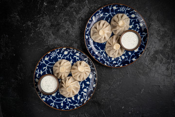 khinkali cooked on blue plate