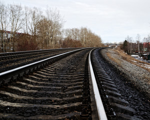 Fototapeta premium railway wooden sleepers. fastening the rails to the sleepers with bolts.