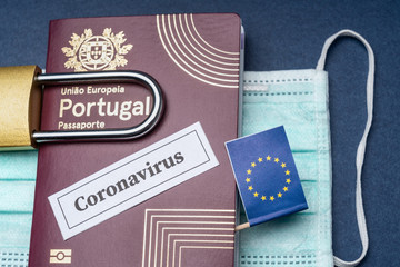 Portuguese European travel passport with padlock and mask on a blue background.