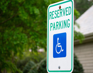 A handicap sign at a parking lot