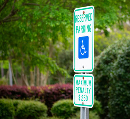 A handicap sign at a parking lot