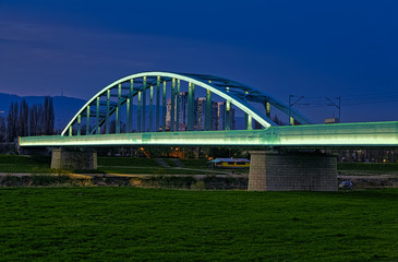 Fototapeta na wymiar The railway bridge over the Sava River in Zagreb, popularly called the Hendrix Bridge. Illuminated by LED light.