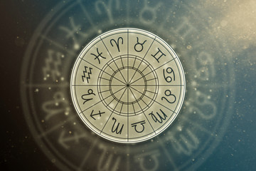 Astrological circle with the signs of the zodiac on a background of the starry sky. Illustration...