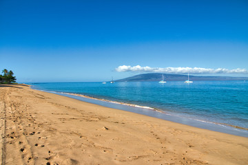 Bright sunny day at Ka'anapali Beach looking out at Lanai.