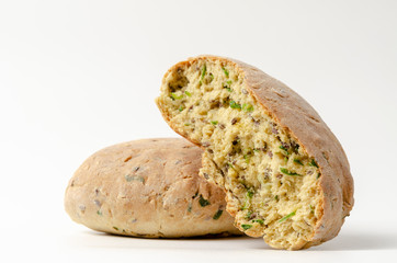 Delicious freshly baked Australian Damper Loaf with onion and linen seeds on white background