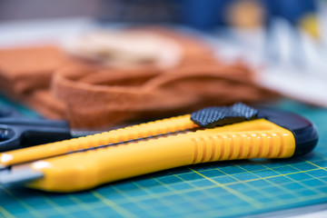 Tools to cut textile on a table