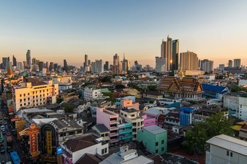 Naklejka premium Bangkok, Thailand - February 2020: Above view from rooftop on China town in the middle of city Bangkok, Thailand