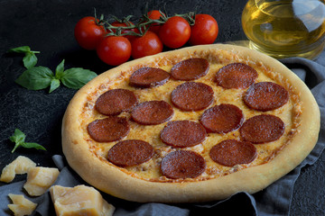pepperoni pizza on a dark background