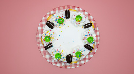 White Cake green Jelly on top on pink background, Closeup Top view Food concept.